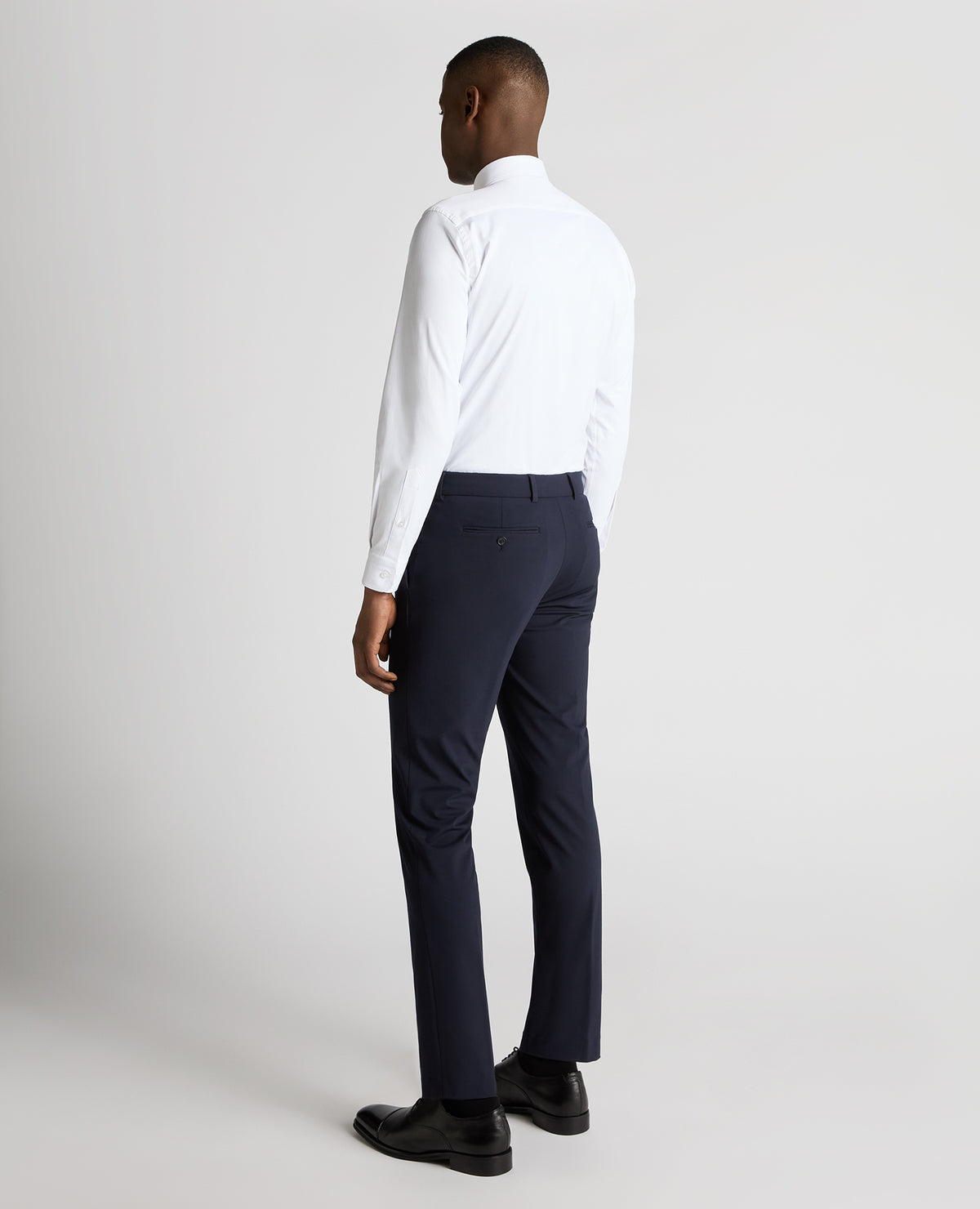 Man wearing a navy Slim Leg Stretch Trousers