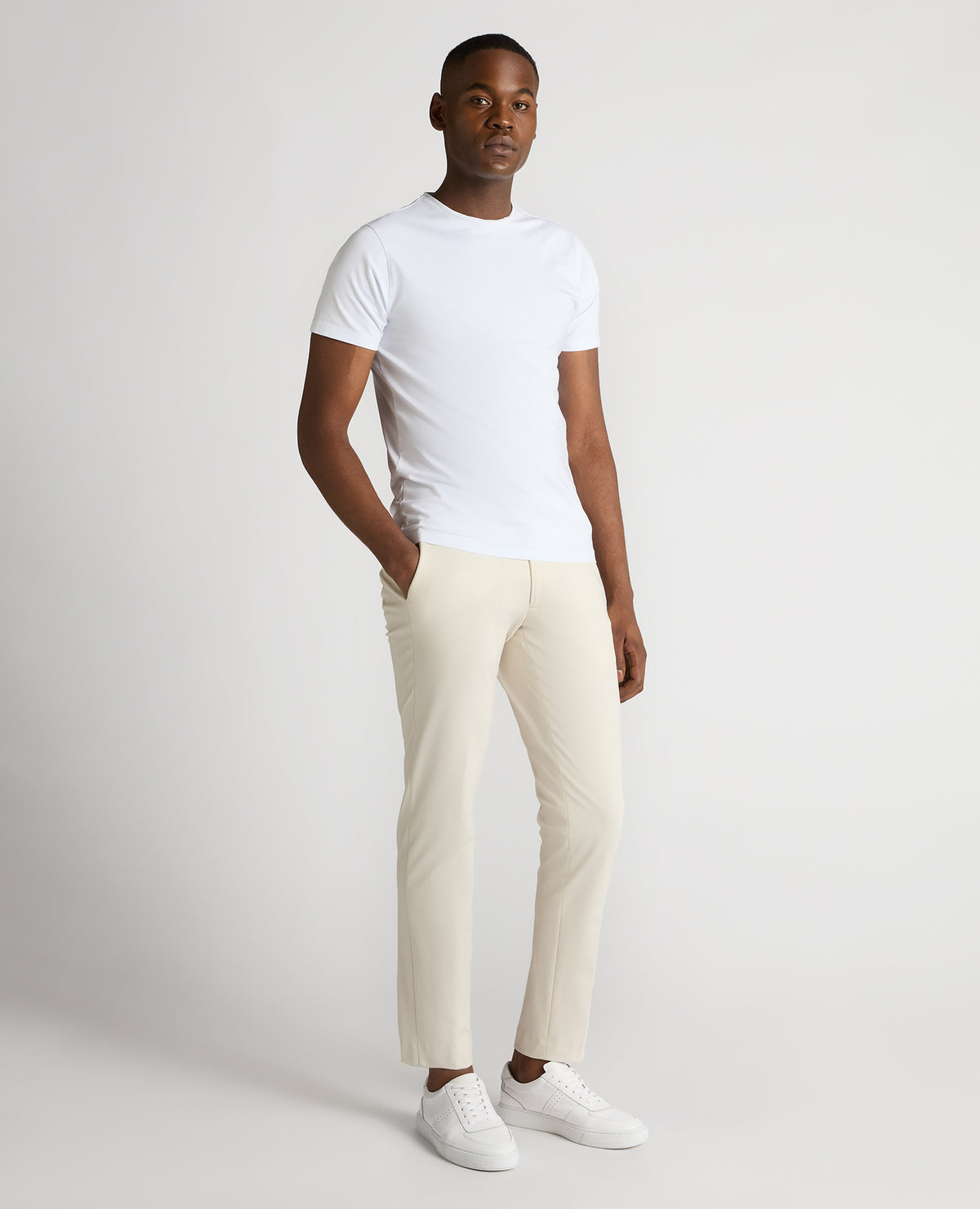 Man wearing a sand Slim Leg Stretch Trousers
