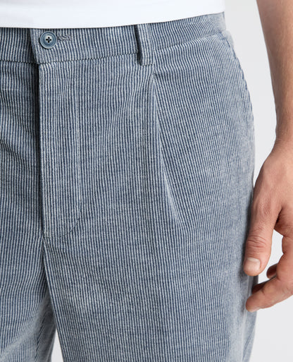 Man wearing a blue Slim Leg Stripe Cotton-Stretch Trousers