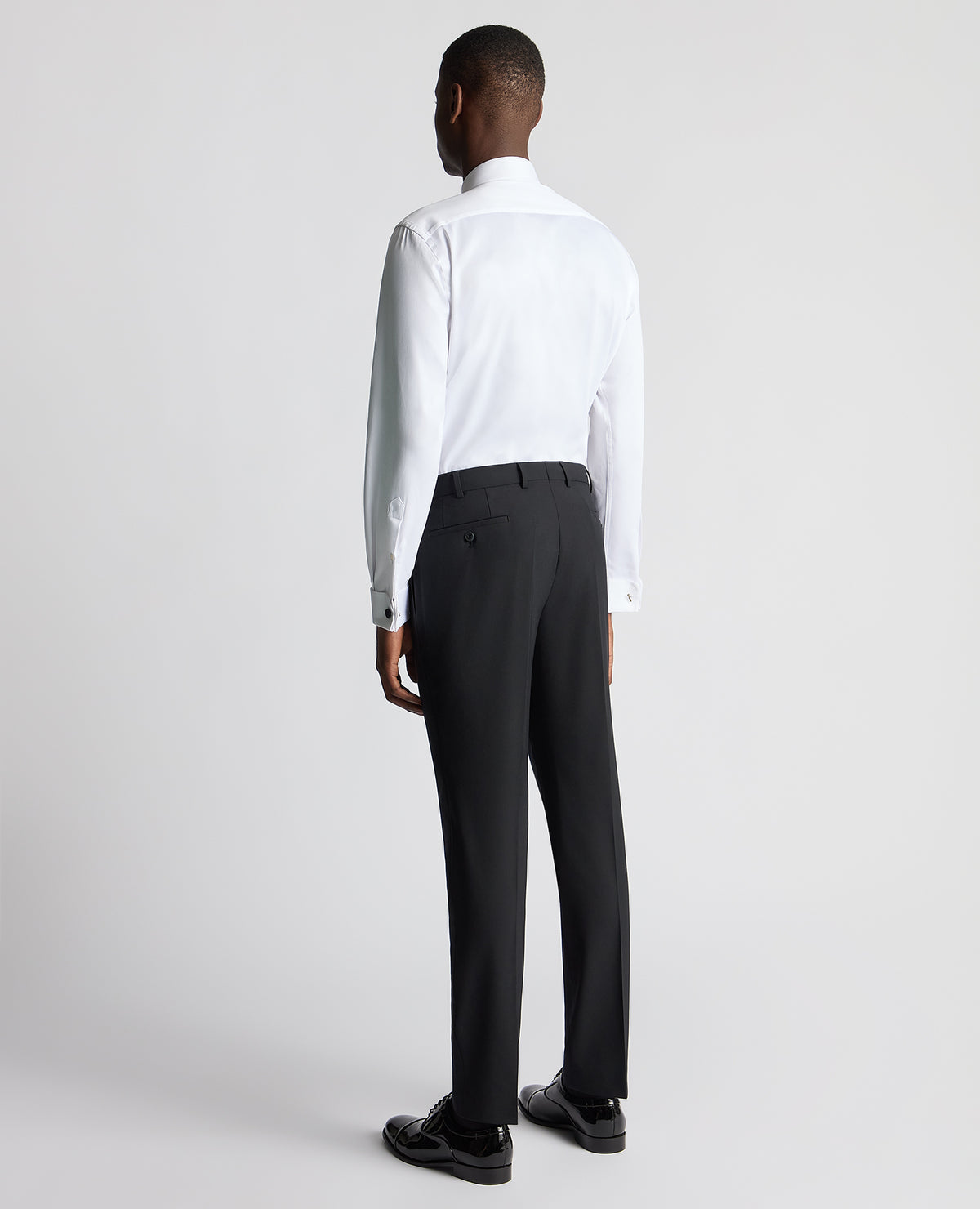 Man wearing a black Slim Fit Wool-Blend Formal Trousers