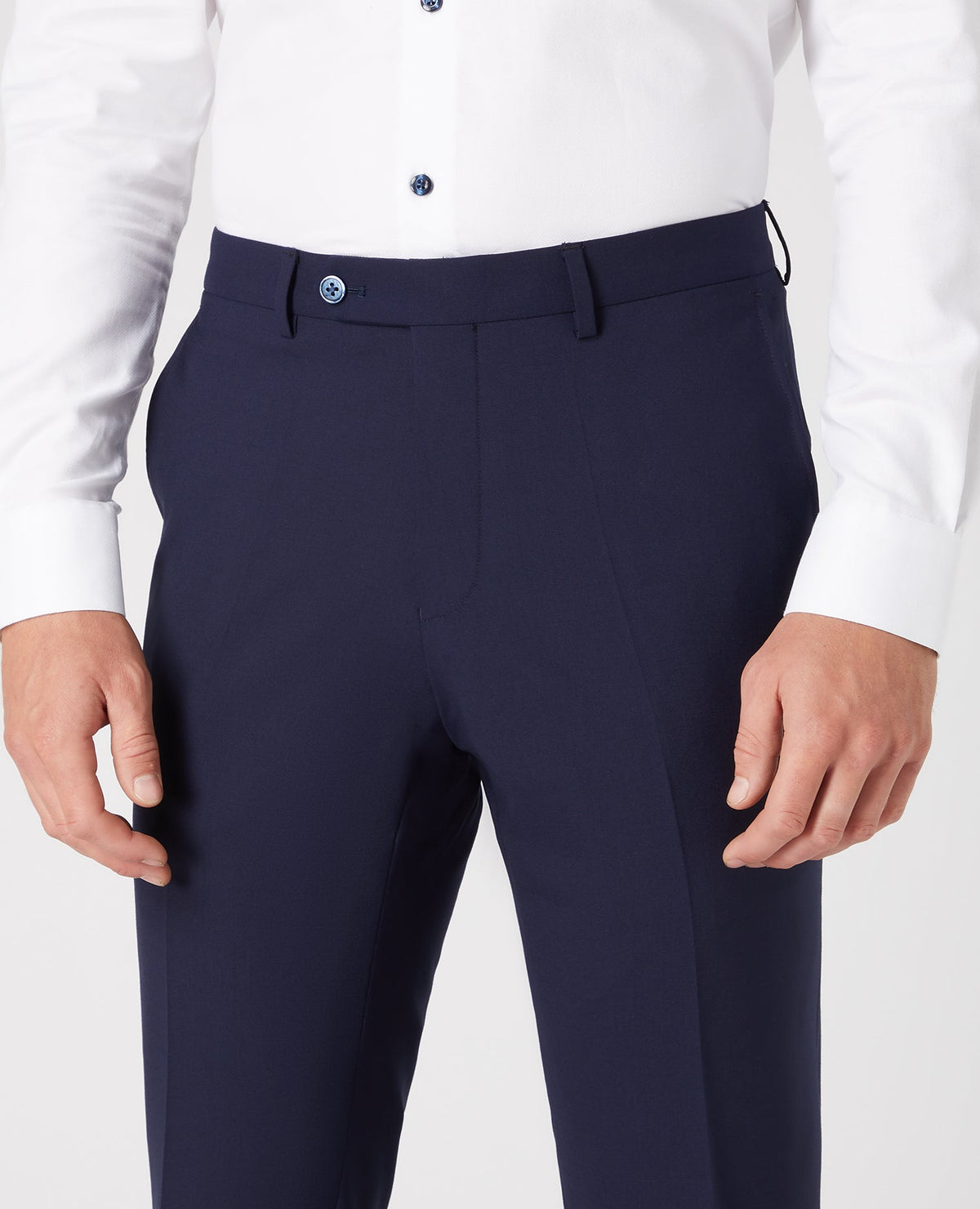 Man wearing a navy Tapered Leg Wool-Blend Suit Trouser