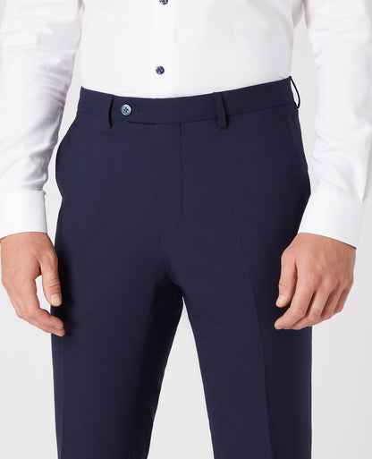 Man wearing a navy Tapered Leg Wool-Blend Suit Trouser