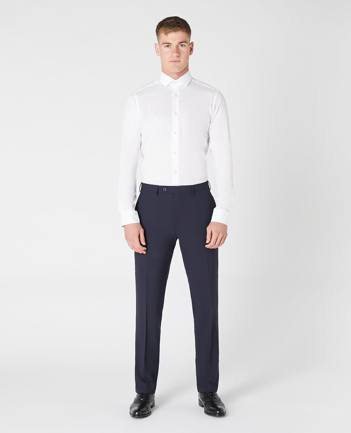 Man wearing a navy Tapered Leg Wool-Blend Suit Trouser