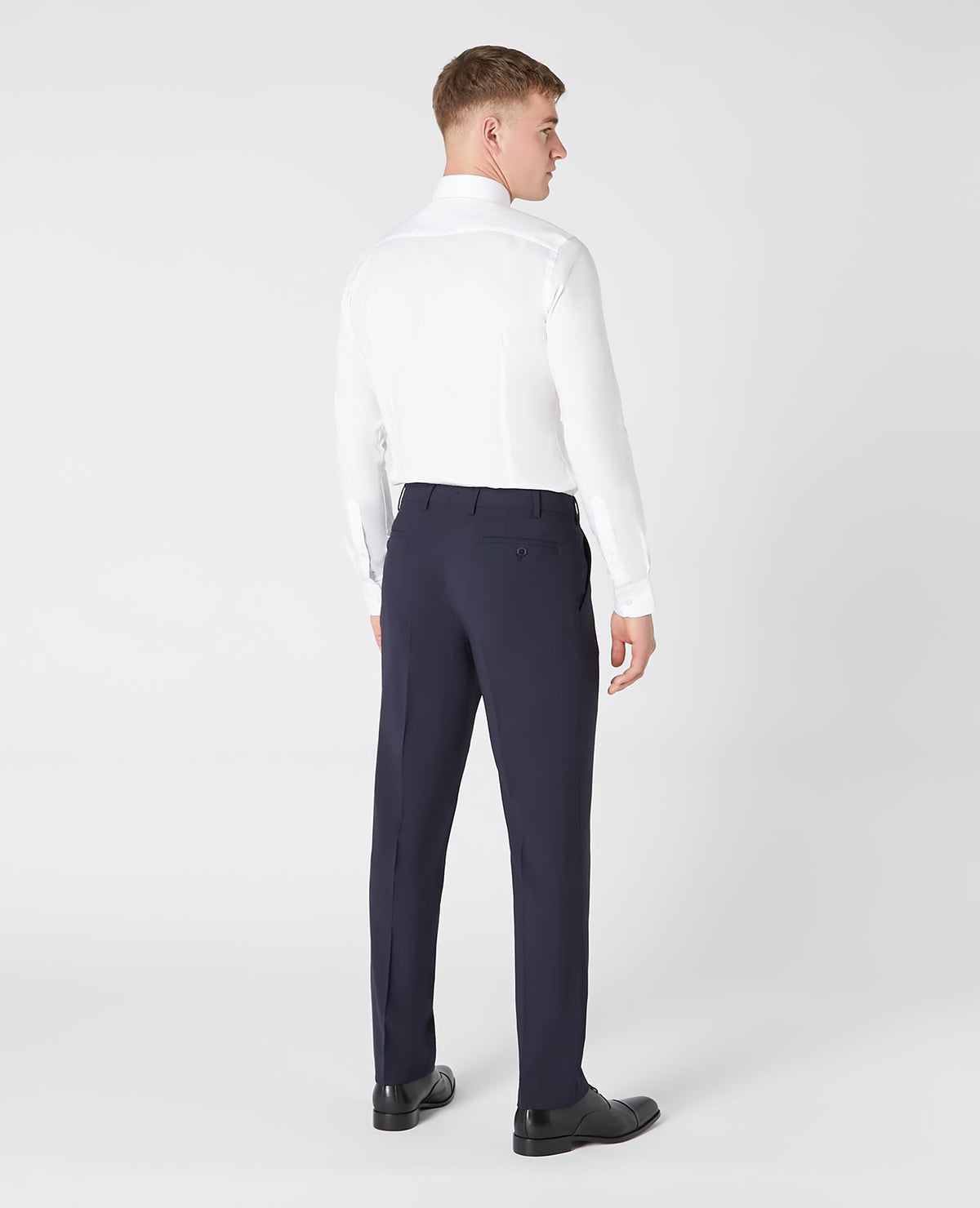 Man wearing a navy Tapered Leg Wool-Blend Suit Trouser