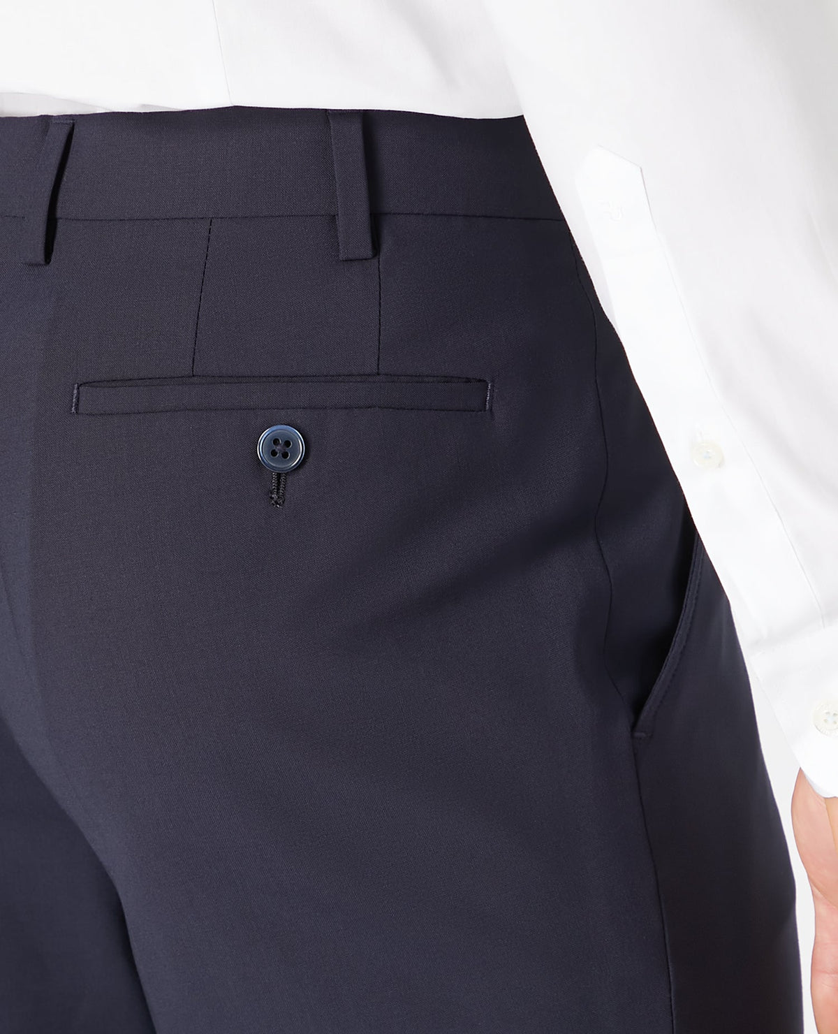 Man wearing a navy Tapered Leg Wool-Blend Suit Trouser
