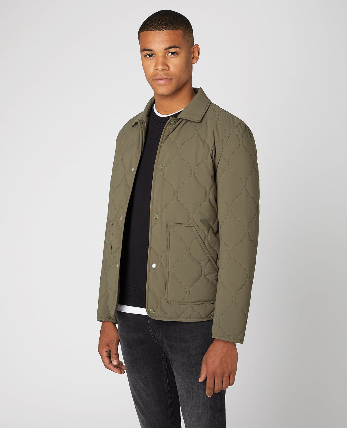 Man wearing a green Lightweight Quilted Overshirt