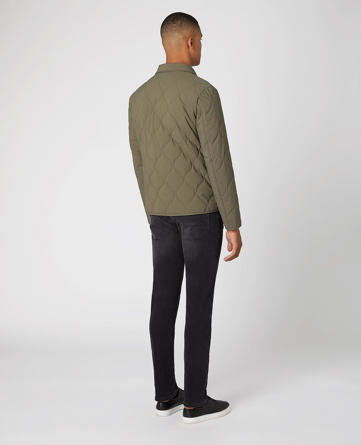 Man wearing a green Lightweight Quilted Overshirt