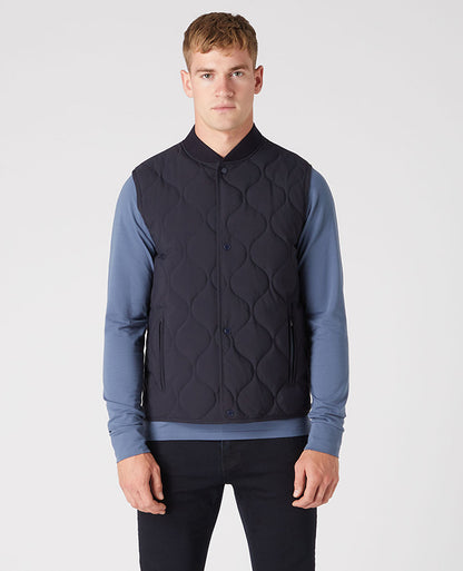 Man wearing a navy Lightweight Quilted Gilet
