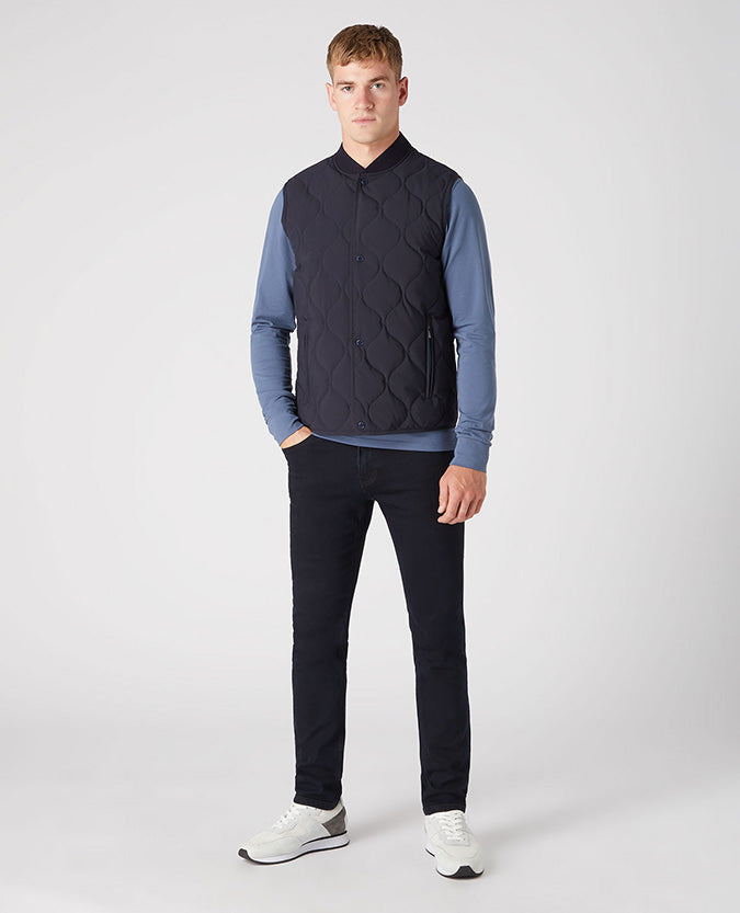 Man wearing a navy Lightweight Quilted Gilet