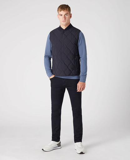 Man wearing a navy Lightweight Quilted Gilet