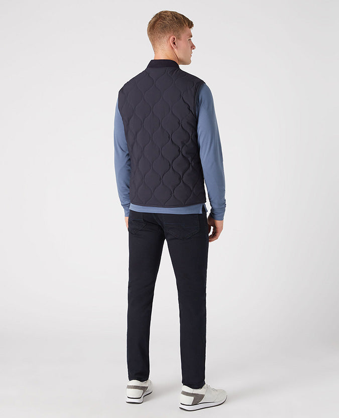 Man wearing a navy Lightweight Quilted Gilet
