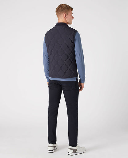 Man wearing a navy Lightweight Quilted Gilet