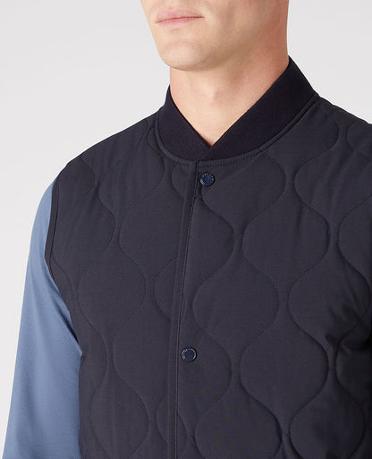 Man wearing a navy Lightweight Quilted Gilet