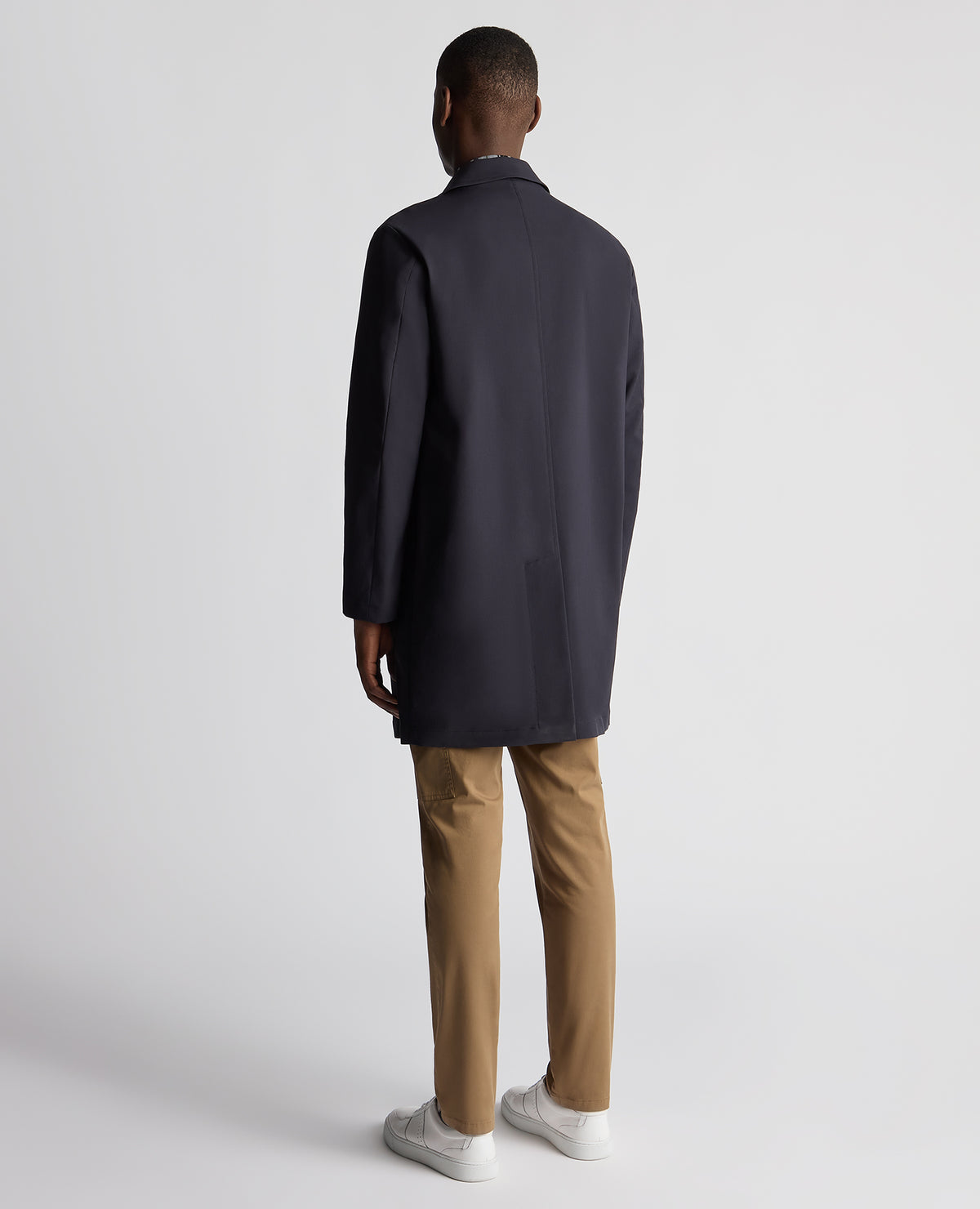 Man wearing a navy Regular Fit Showerproof Mac