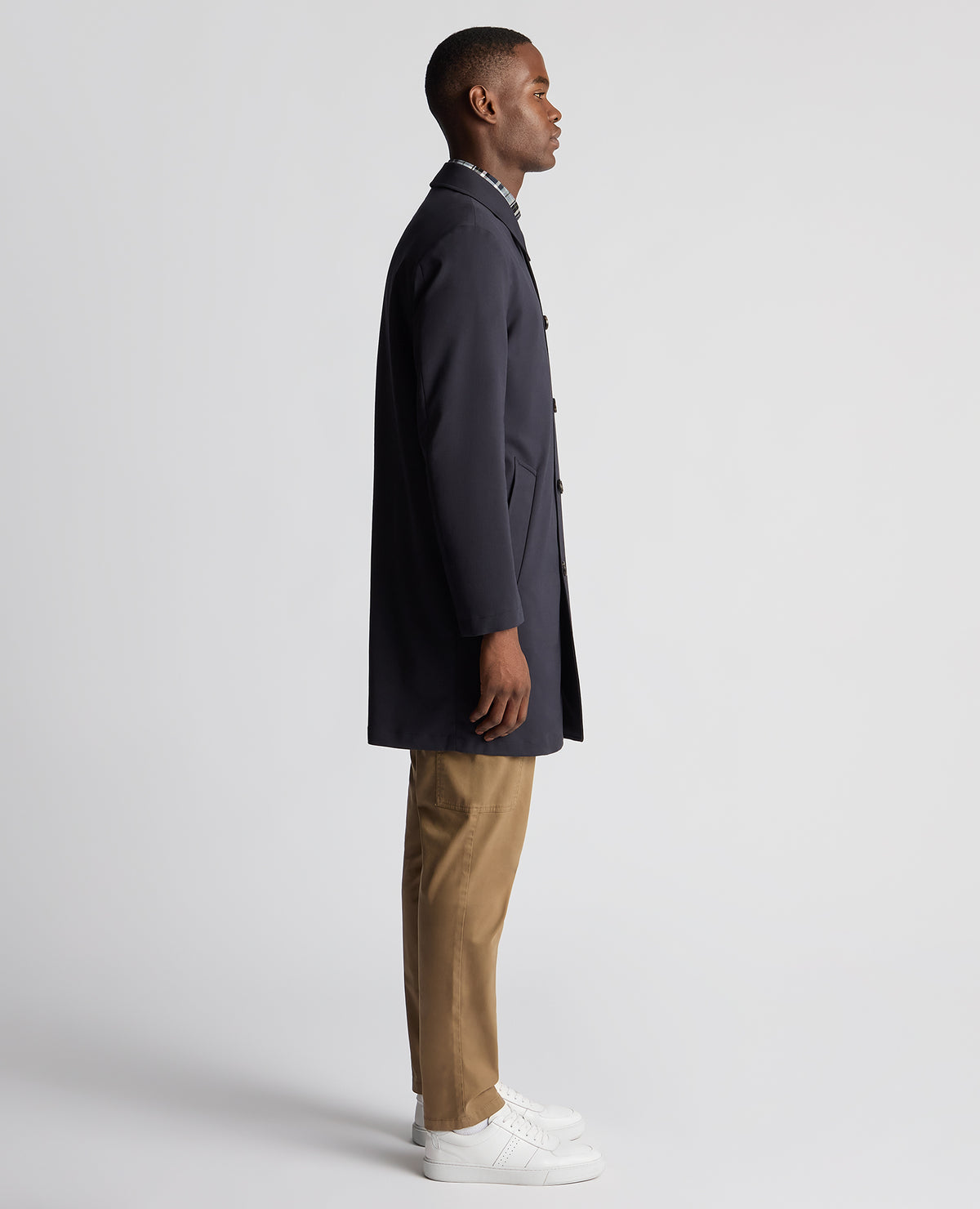 Man wearing a navy Regular Fit Showerproof Mac