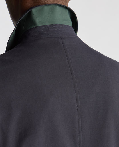 Man wearing a navy Regular Fit Showerproof Mac