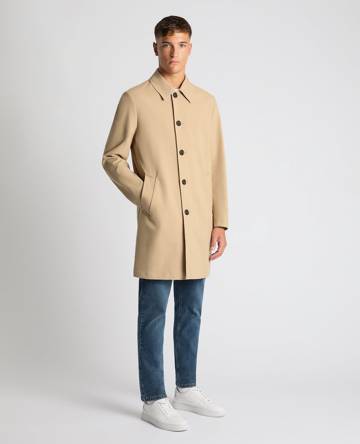 Man wearing a sand Regular Fit Showerproof Mac