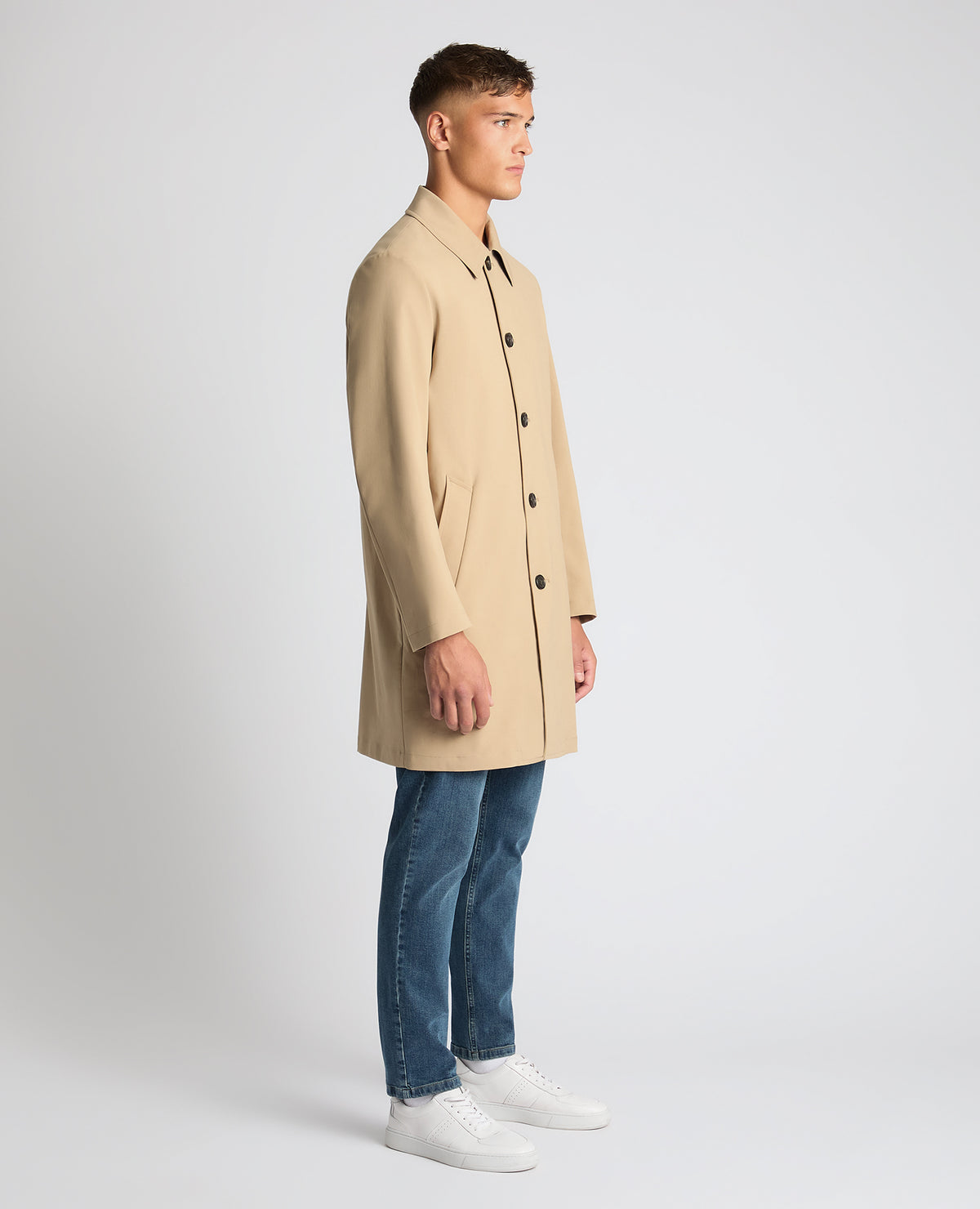 Man wearing a sand Regular Fit Showerproof Mac