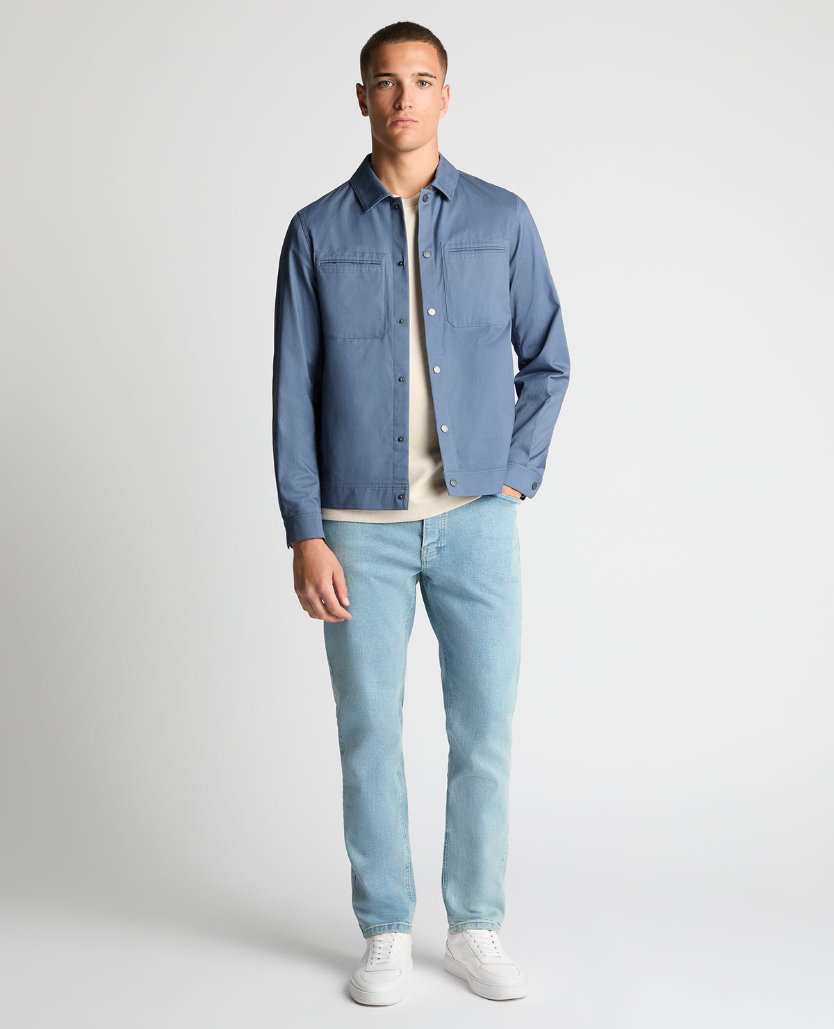Man wearing a blue Regular Fit Cotton Twill Utility Jacket