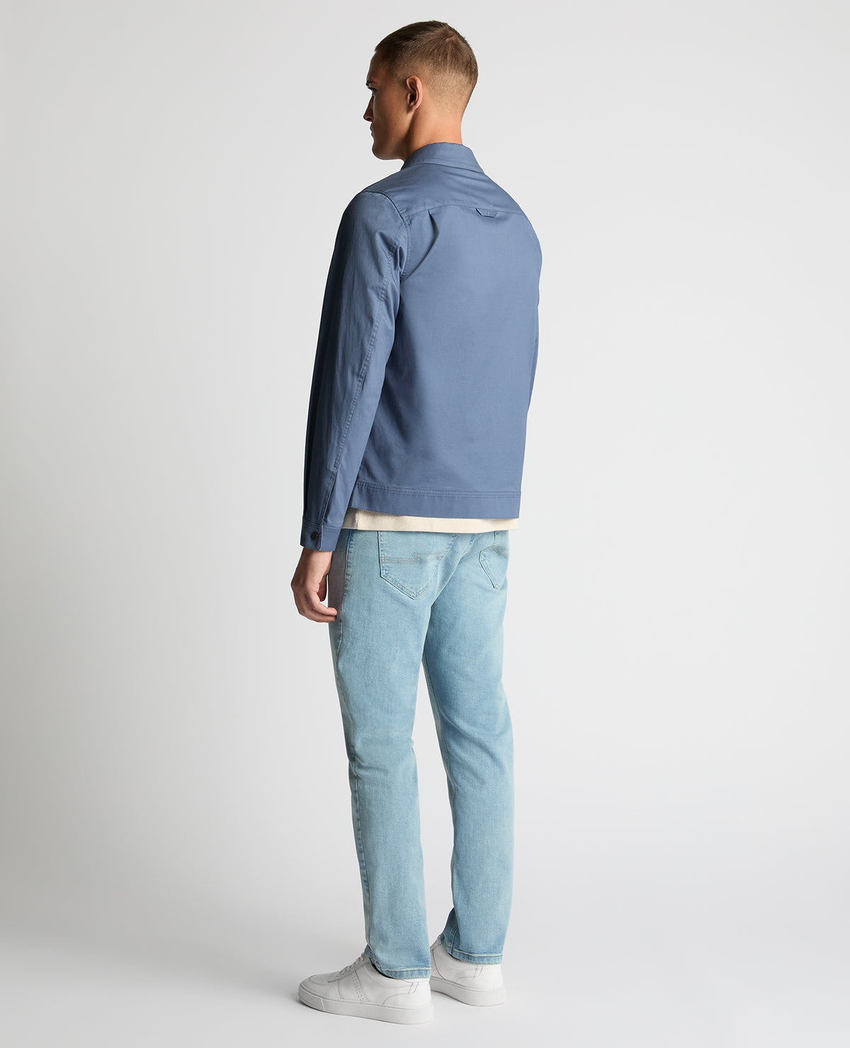 Man wearing a blue Regular Fit Cotton Twill Utility Jacket