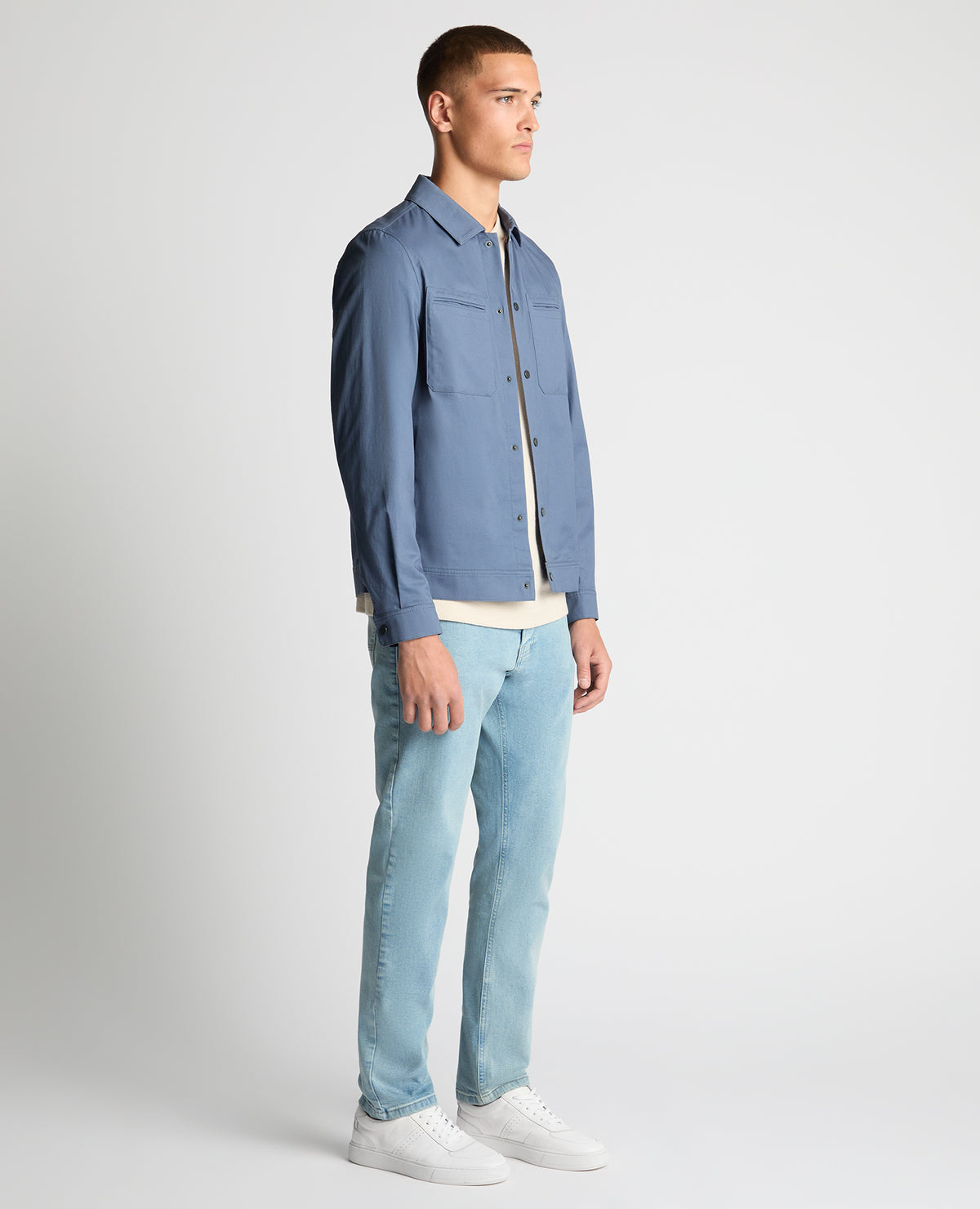 Man wearing a blue Regular Fit Cotton Twill Utility Jacket