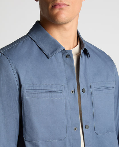 Man wearing a blue Regular Fit Cotton Twill Utility Jacket