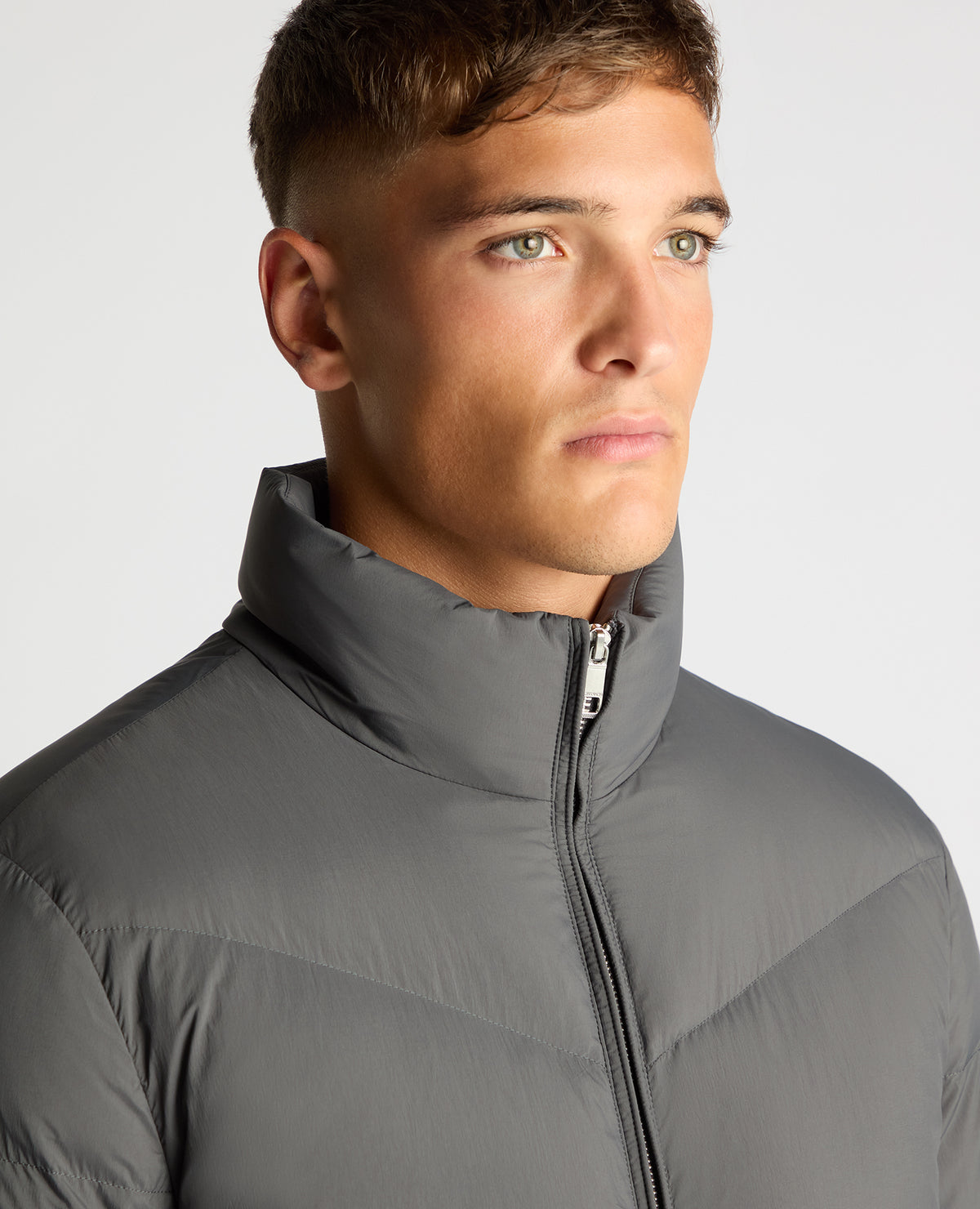 Man wearing a grey Regular Fit Down-Filled Quilted Jacket