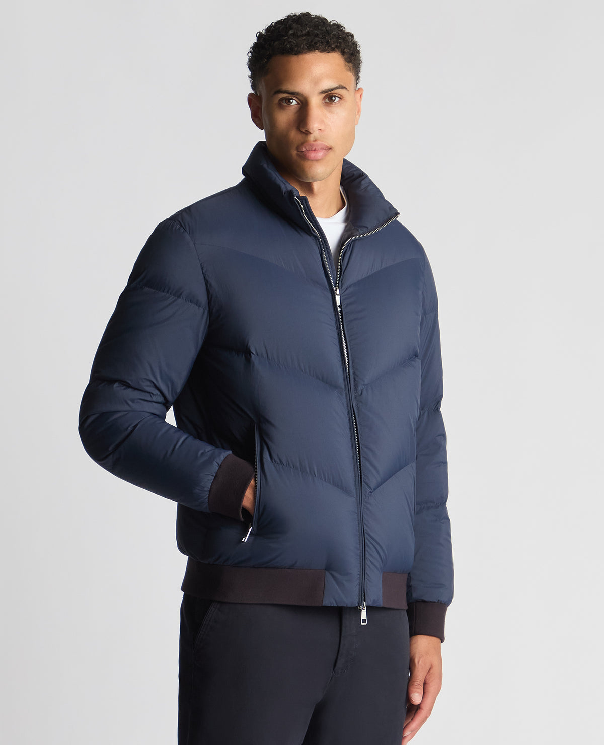 Man wearing a blue Regular Fit Down-Filled Quilted Jacket