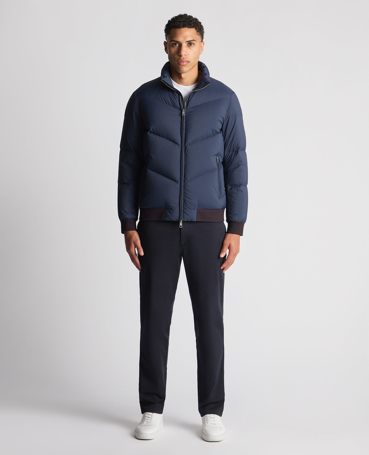 Man wearing a blue Regular Fit Down-Filled Quilted Jacket