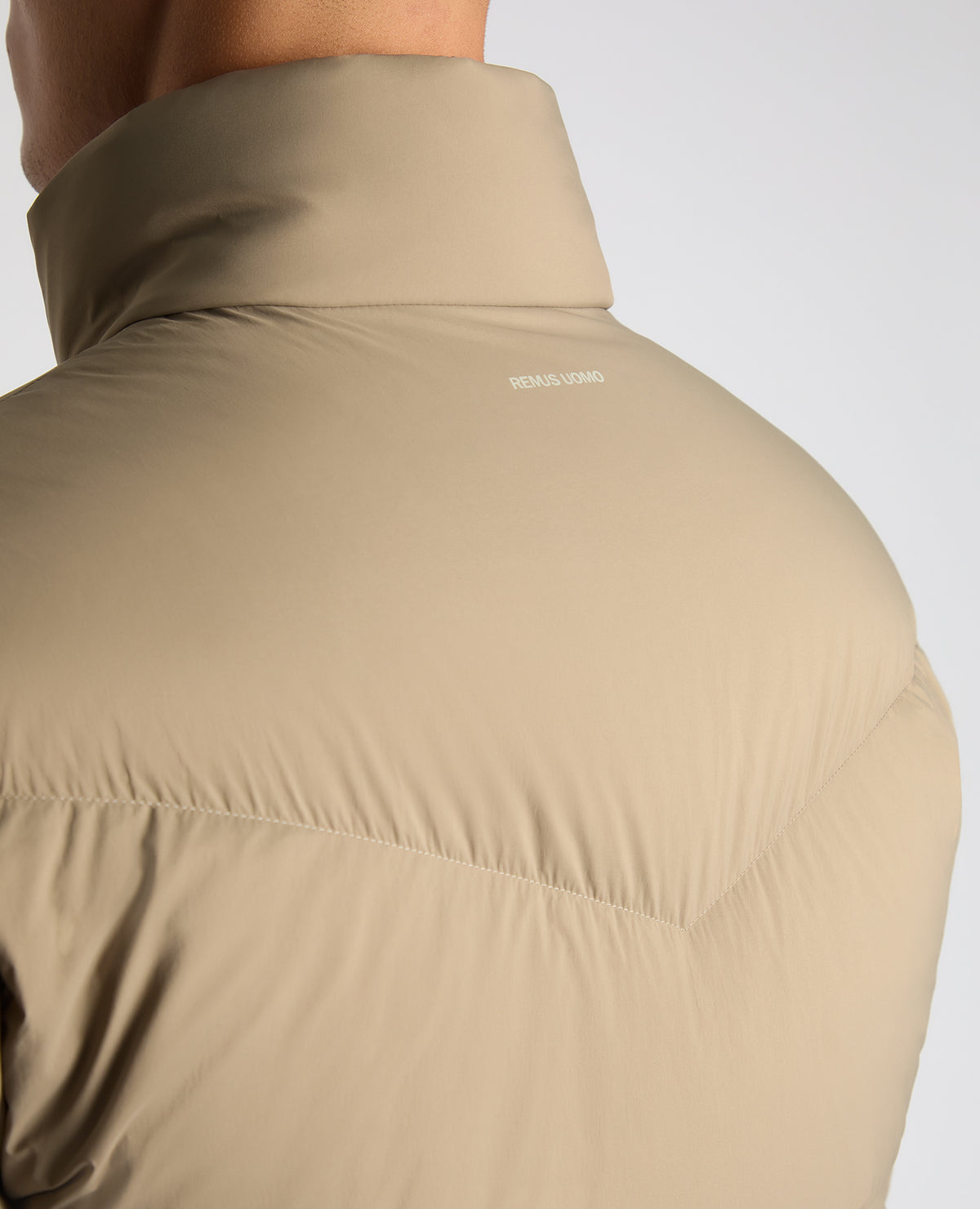 Man wearing a sand Regular Fit Down-Filled Quilted Jacket