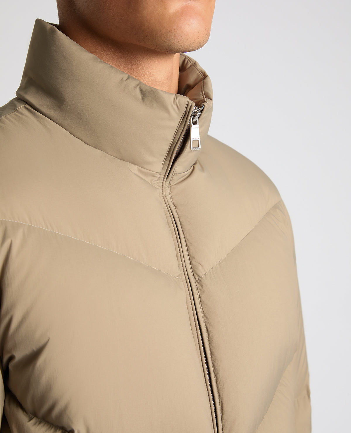 Man wearing a sand Regular Fit Down-Filled Quilted Jacket