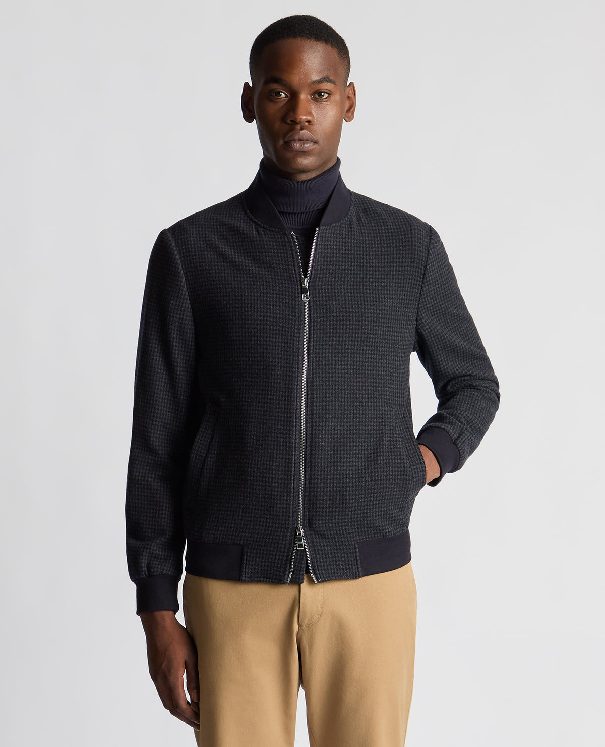 Man wearing a navy Regular Fit Club Check Flannel Bomber Jacket