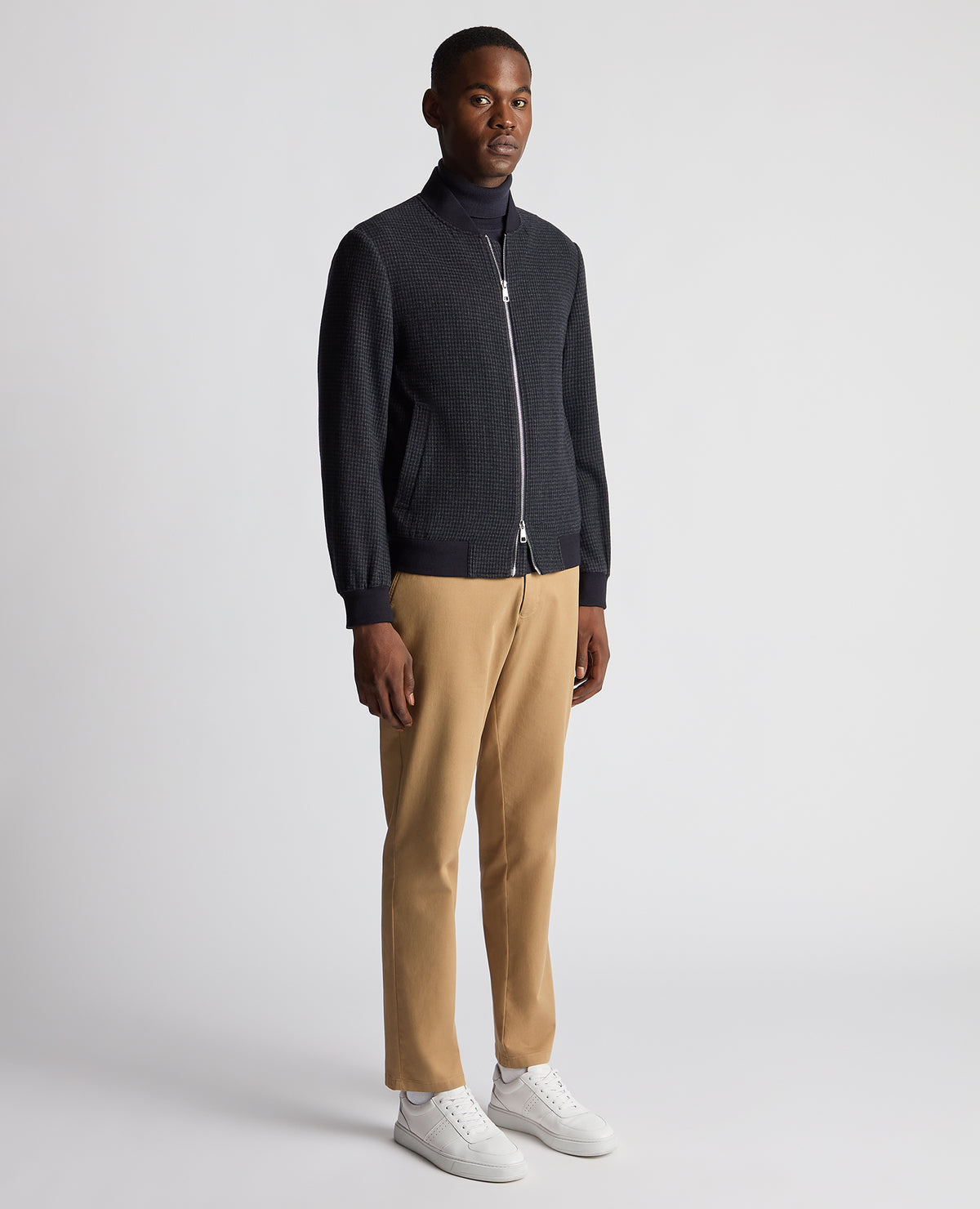Man wearing a navy Regular Fit Club Check Flannel Bomber Jacket