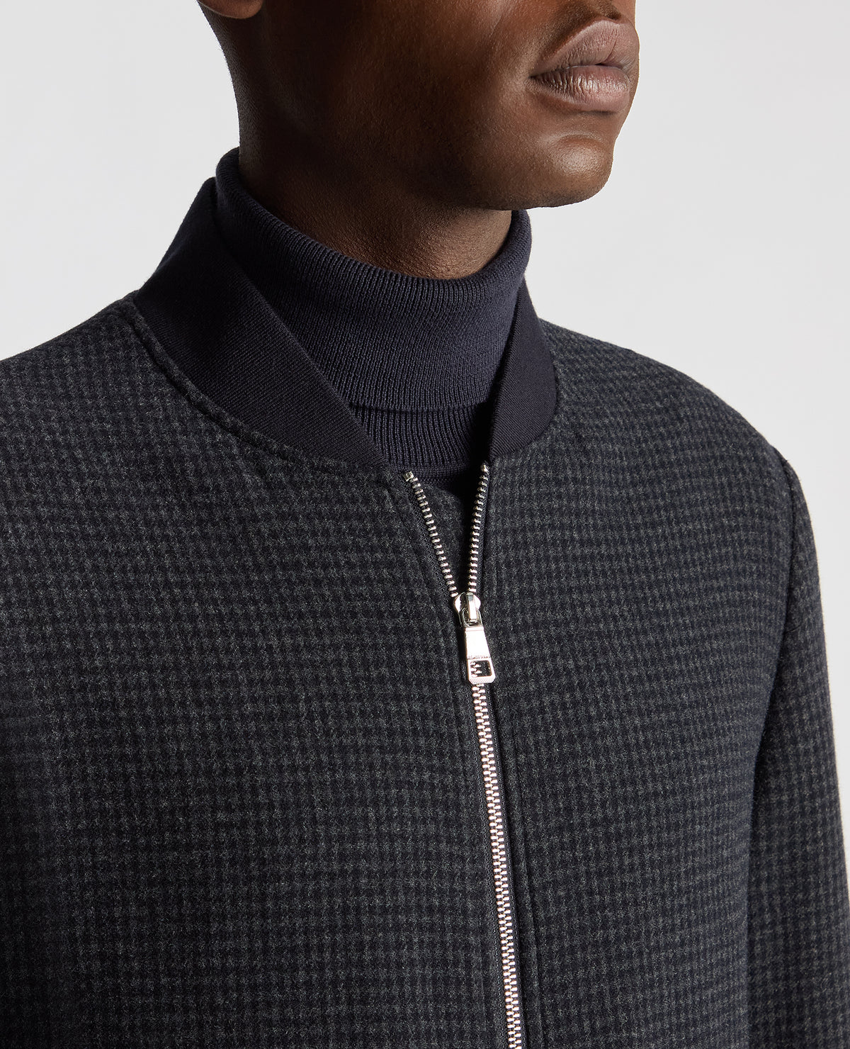 Man wearing a navy Regular Fit Club Check Flannel Bomber Jacket