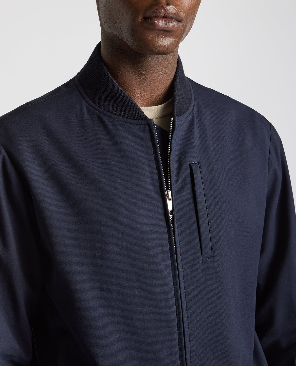 Man wearing a navy Regular Fit Showerproof Bomber Jacket