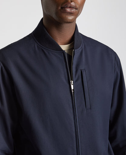Man wearing a navy Regular Fit Showerproof Bomber Jacket