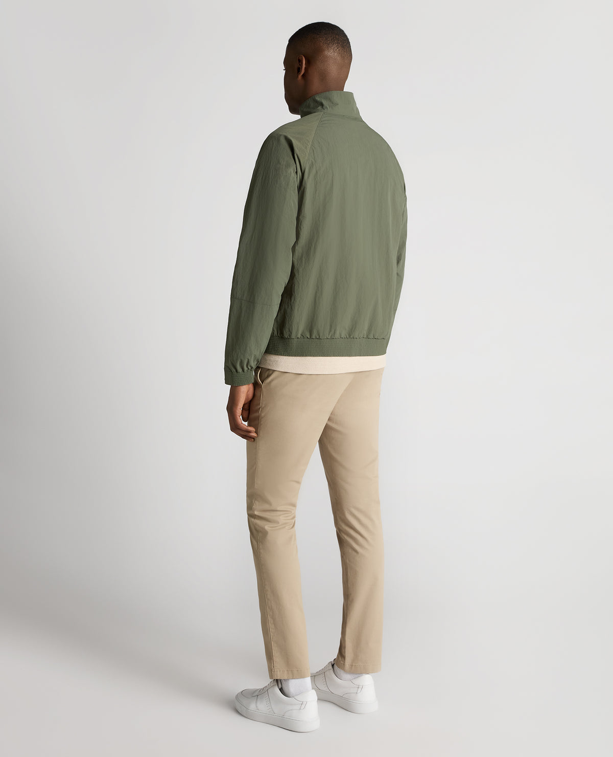 Man wearing a green Regular Fit Showerproof Harrington Jacket