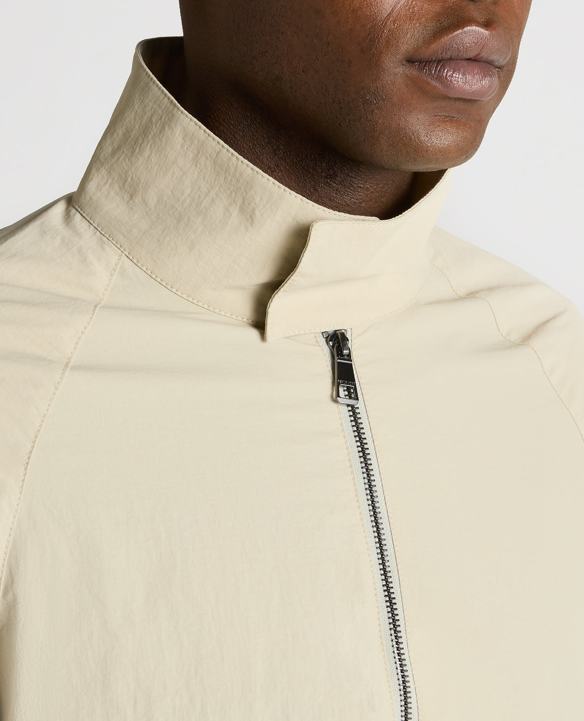 Man wearing a sand Regular Fit Showerproof Harrington Jacket