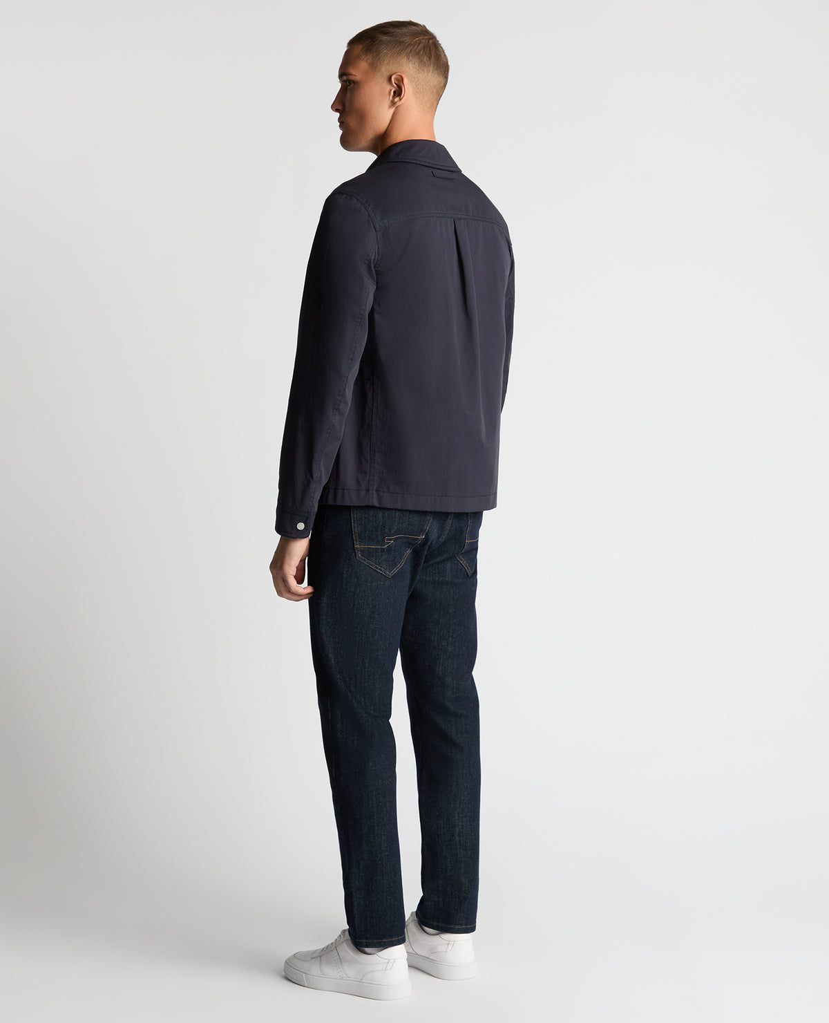 Man wearing a navy Regular Fit Cotton Twill Chore Jacket