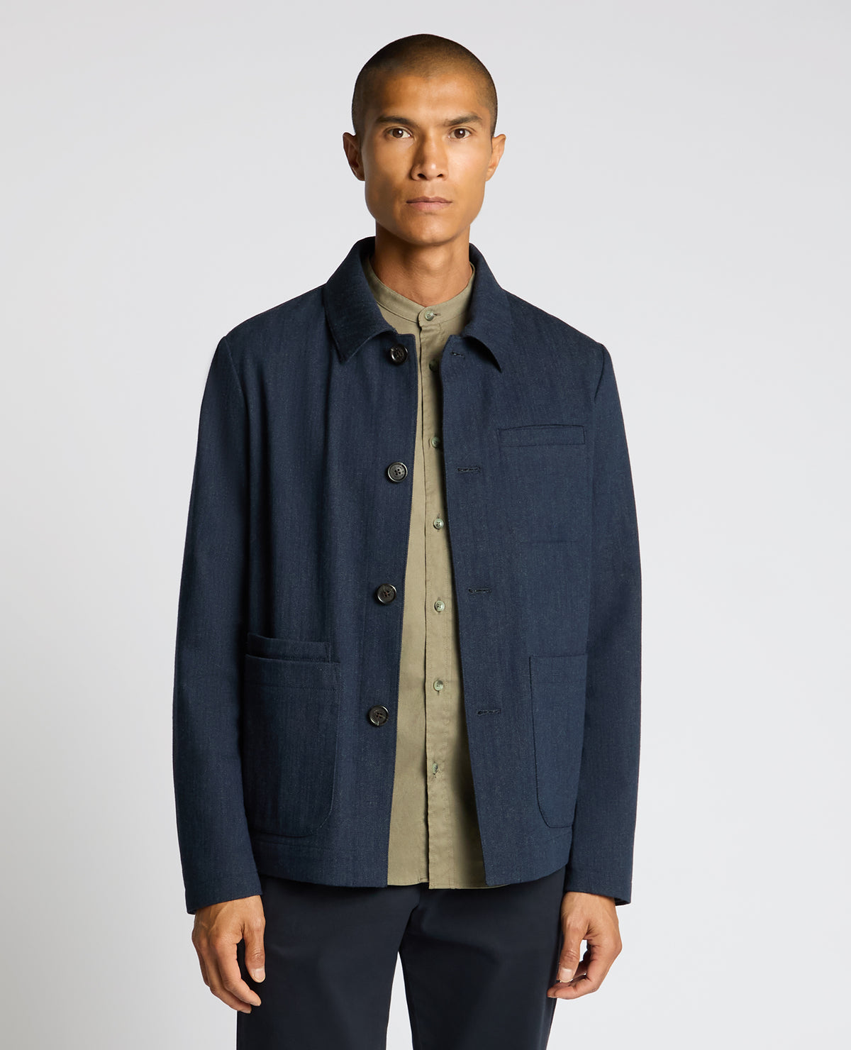 Man wearing a navy Cotton Chore Jacket