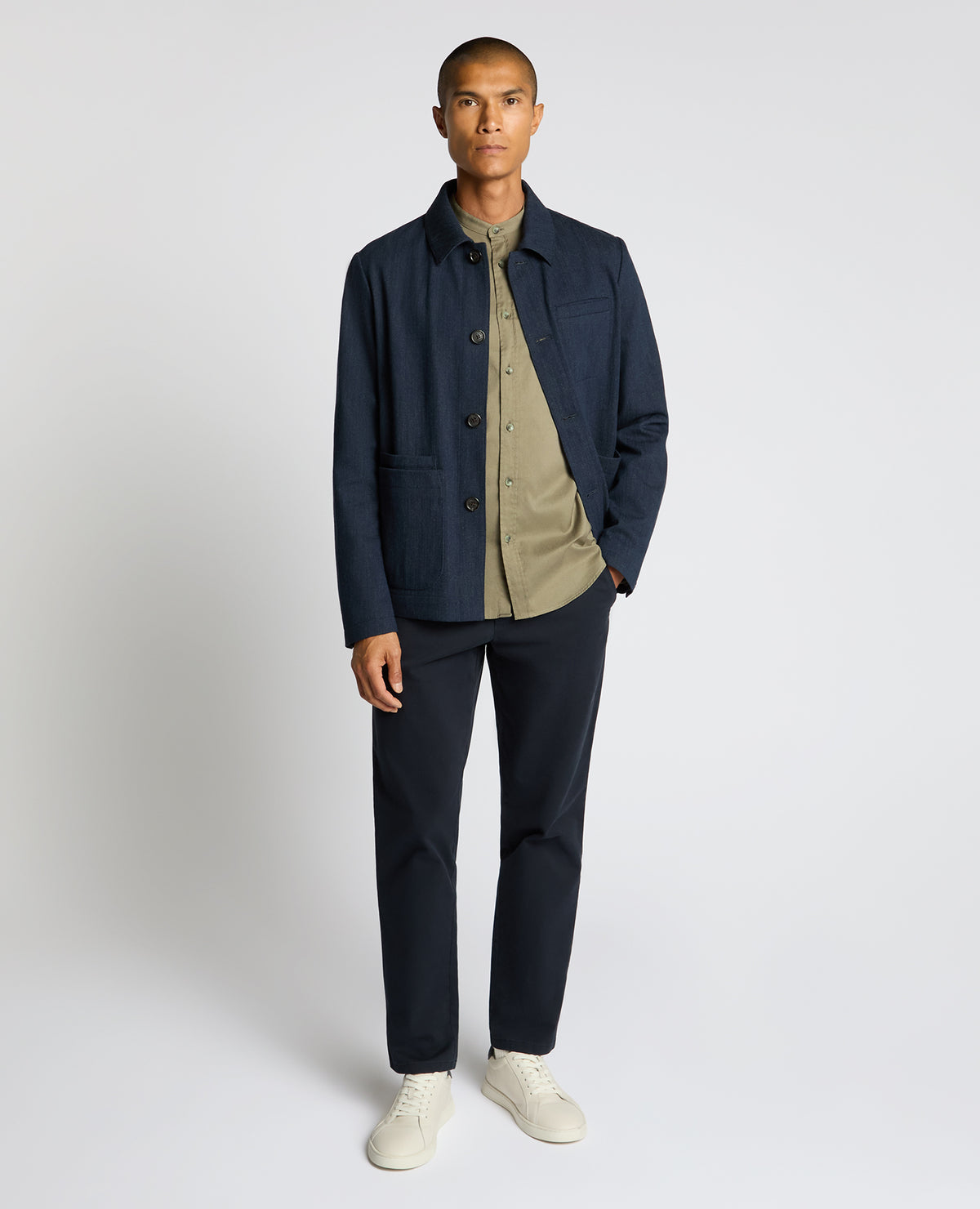 Man wearing a navy Cotton Chore Jacket