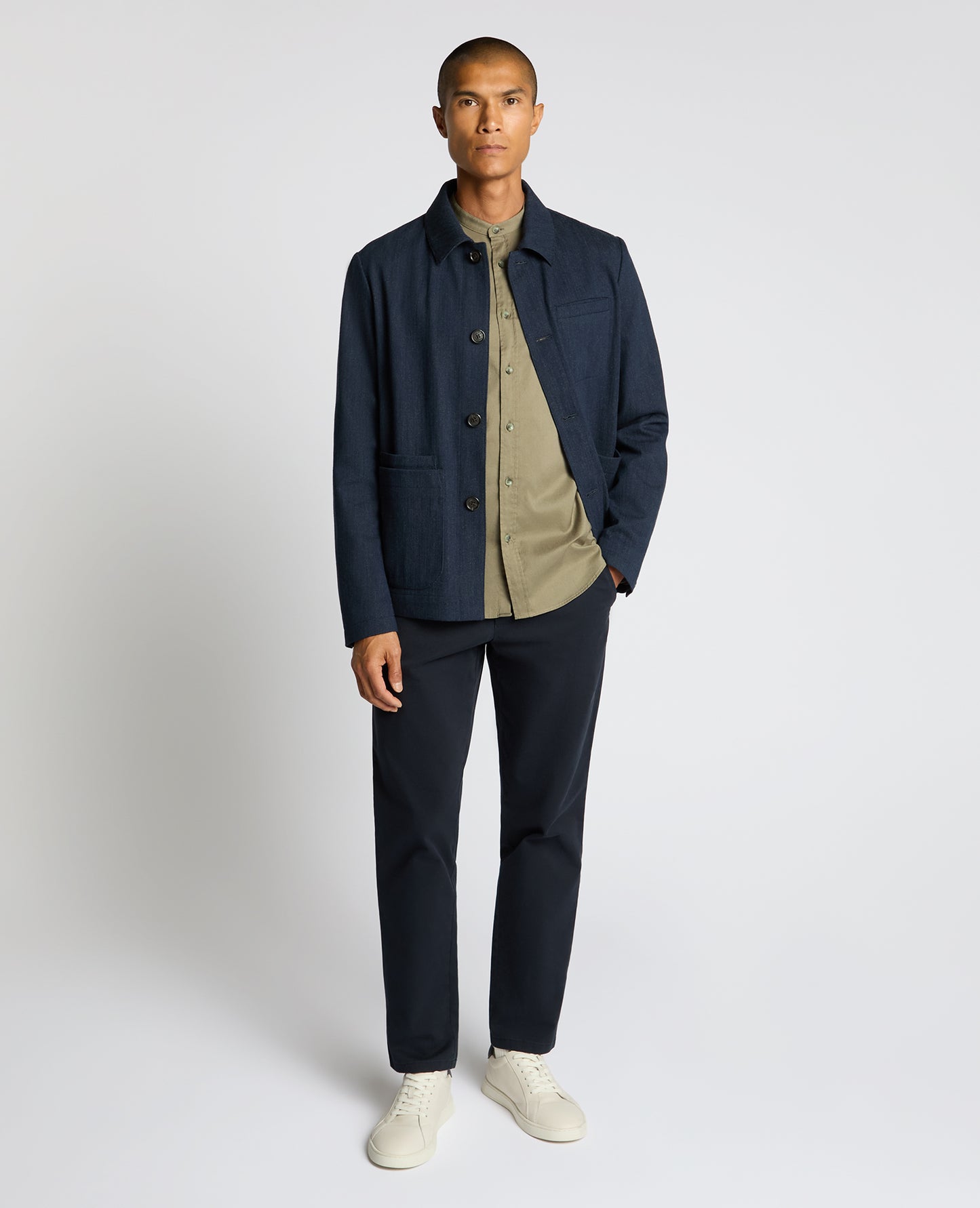 Man wearing a navy Cotton Chore Jacket