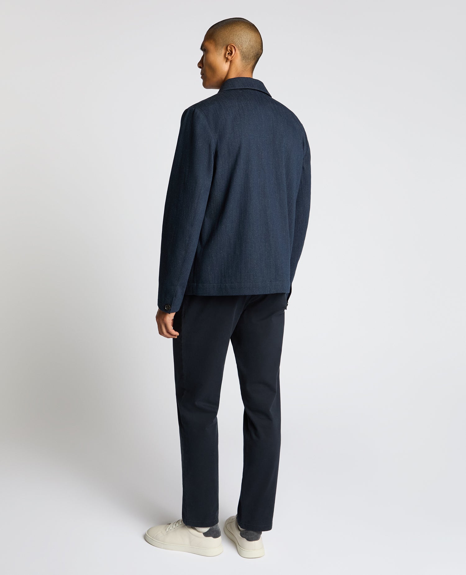 Man wearing a navy Cotton Chore Jacket