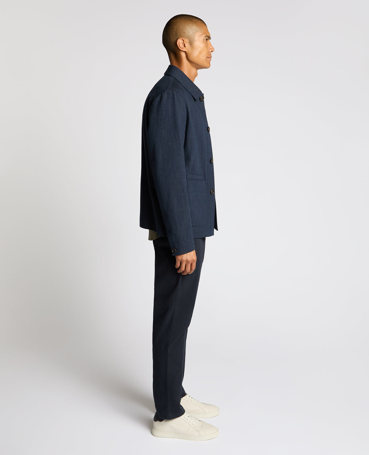 Man wearing a navy Cotton Chore Jacket