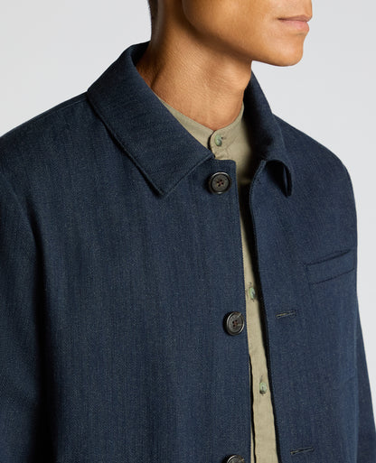 Man wearing a navy Cotton Chore Jacket