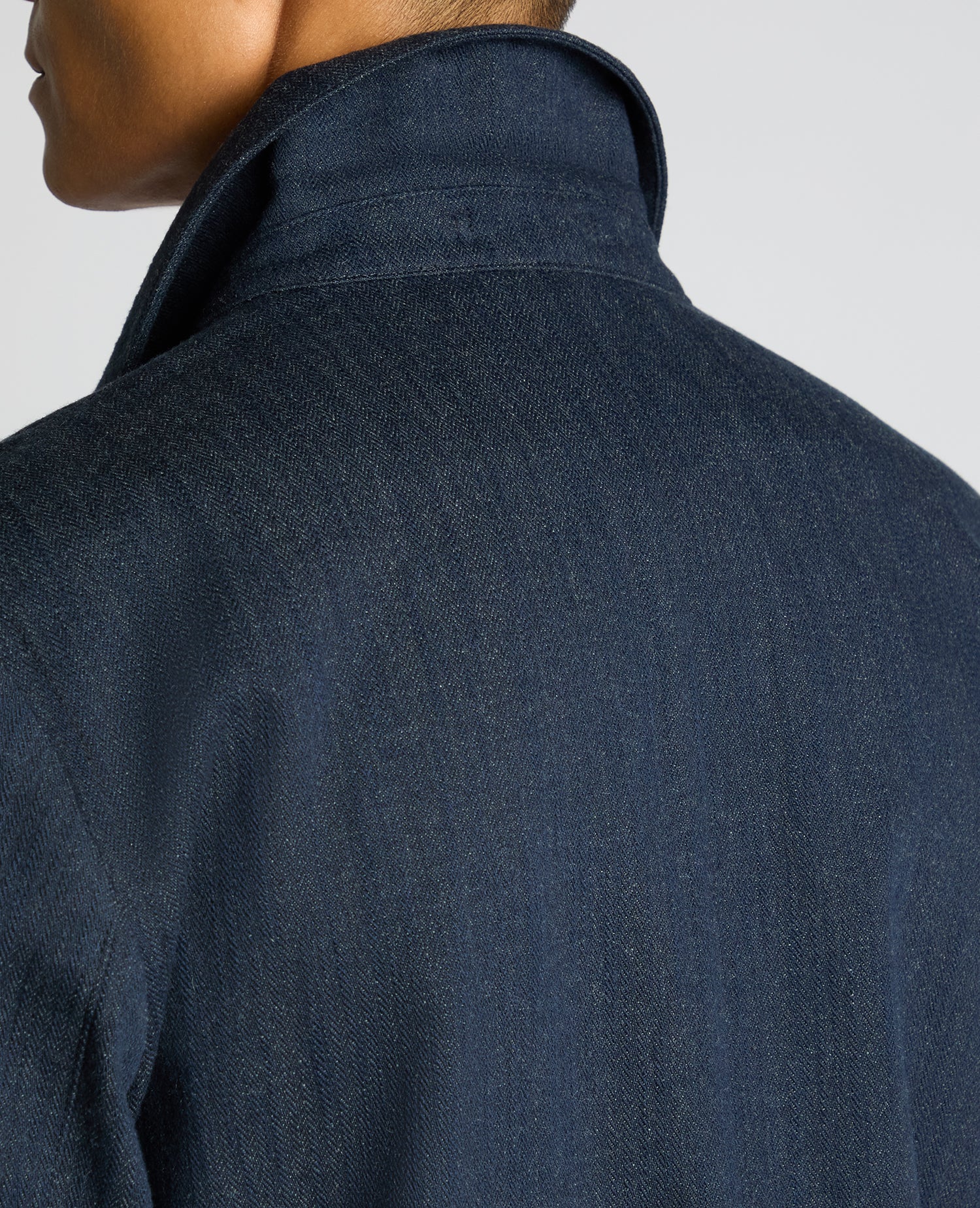 Man wearing a navy Cotton Chore Jacket