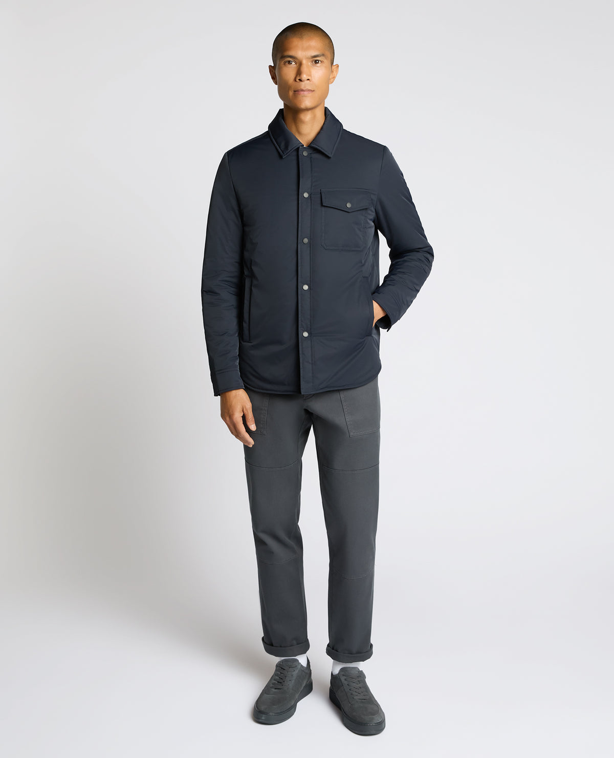 Man wearing a navy Padded Button-Up Jacket