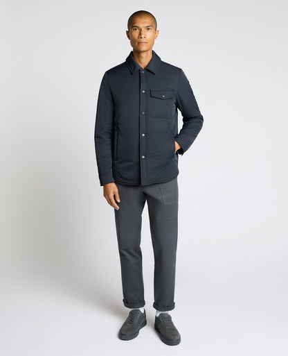 Man wearing a navy Padded Button-Up Jacket