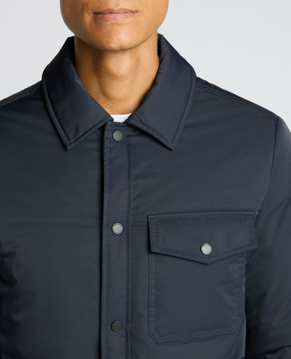 Man wearing a navy Padded Button-Up Jacket