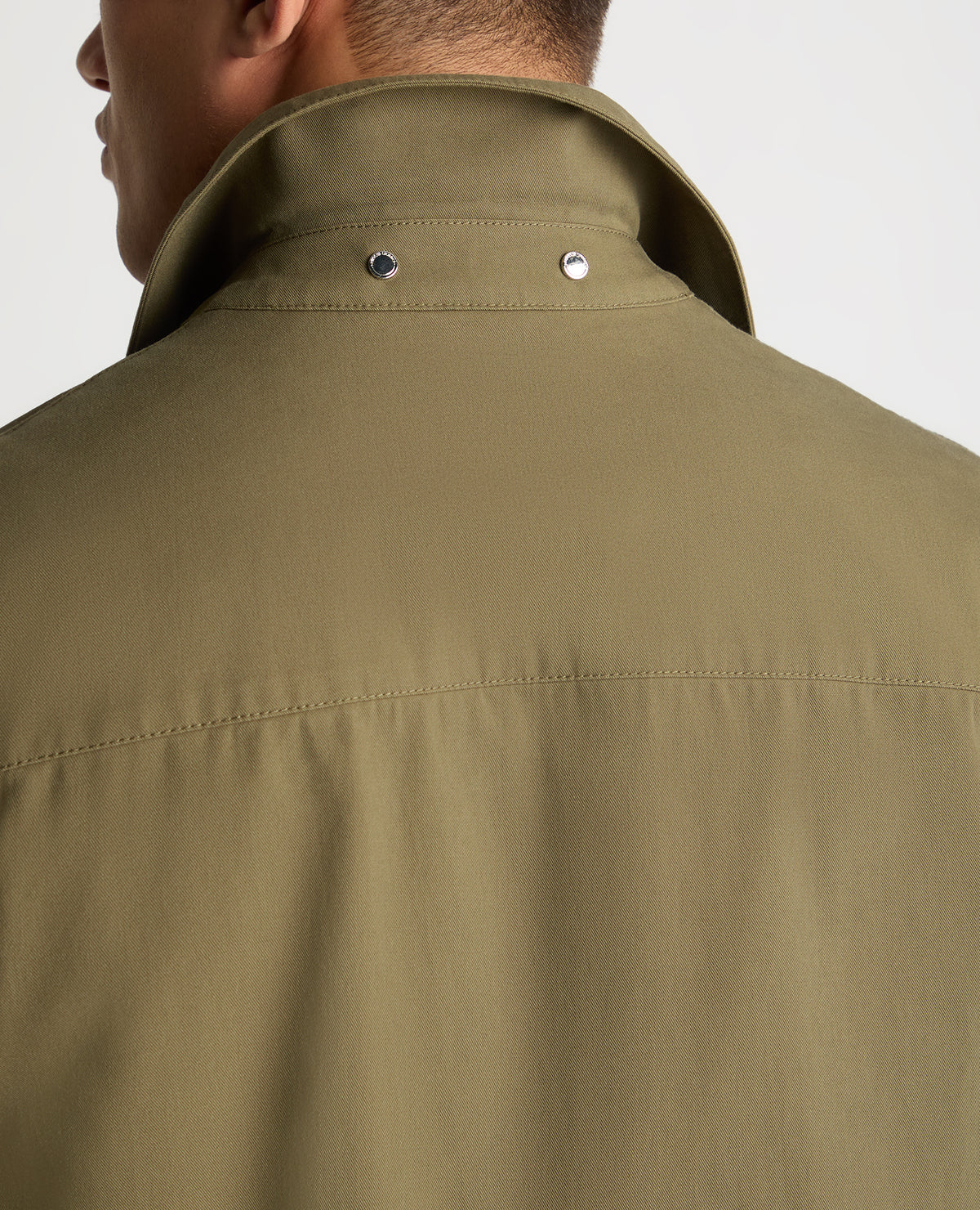 Man wearing a green jacket